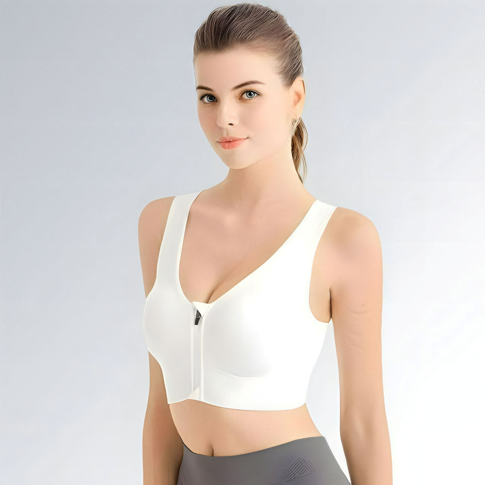 Sutiã esportivo feminino branco com zíper frontal, decote V profundo e alças largas para sustentação.