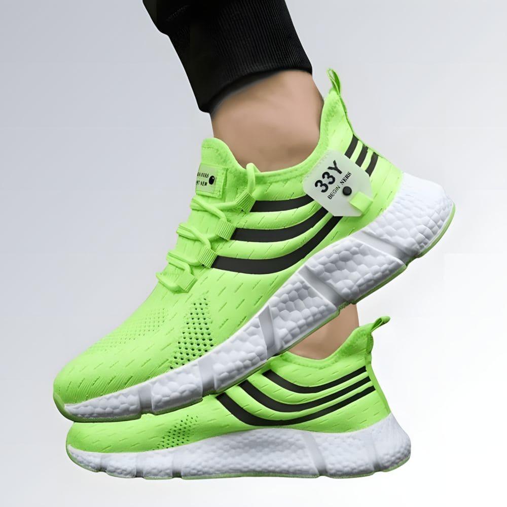 Tênis unissex verde neon Begin Ners com listras pretas, solado branco antiderrapante e design esportivo moderno.