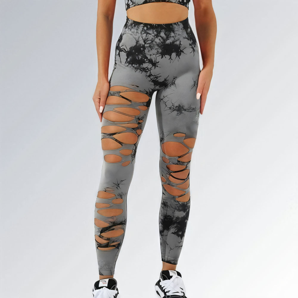 Calça legging feminina cinza estilo tie-dye com cintura alta, recortes frontais e design sem costura para looks urbanos e esportivos.