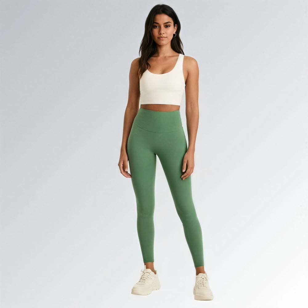Calça legging feminina verde de cintura alta, modelo compressão, ideal para academia, yoga e treinos, com ajuste anatômico e tecido elástico.