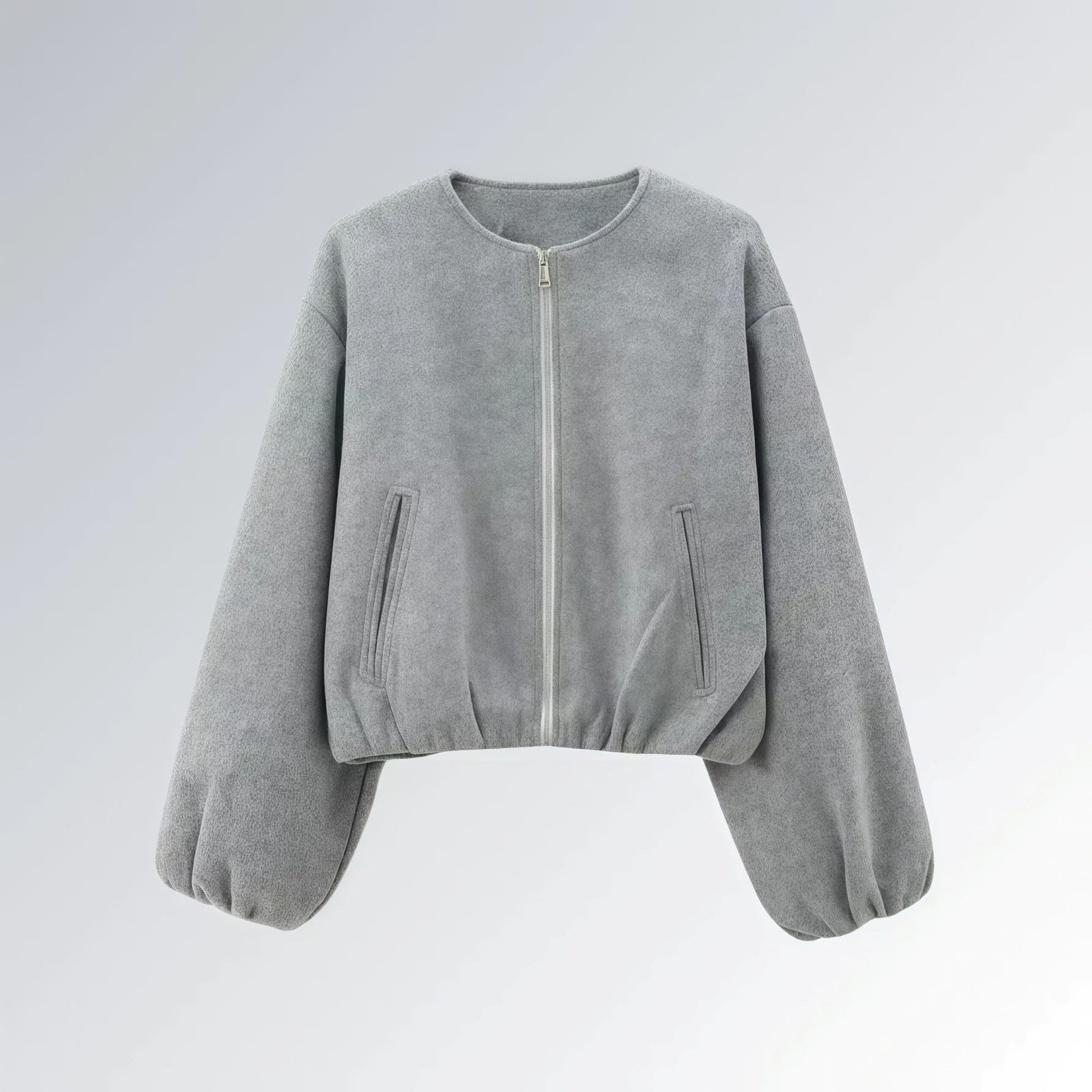 Jaqueta feminina cinza com zíper metálico, mangas bufantes e bolsos frontais, estilo casual streetwear para o outono.