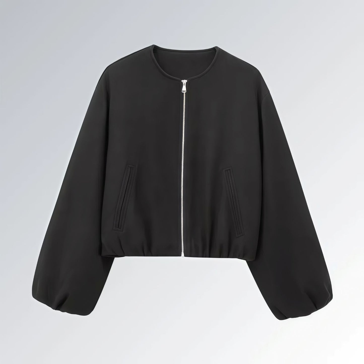 Jaqueta feminina preta com zíper metálico, mangas bufantes e bolsos frontais, estilo casual streetwear para o outono.