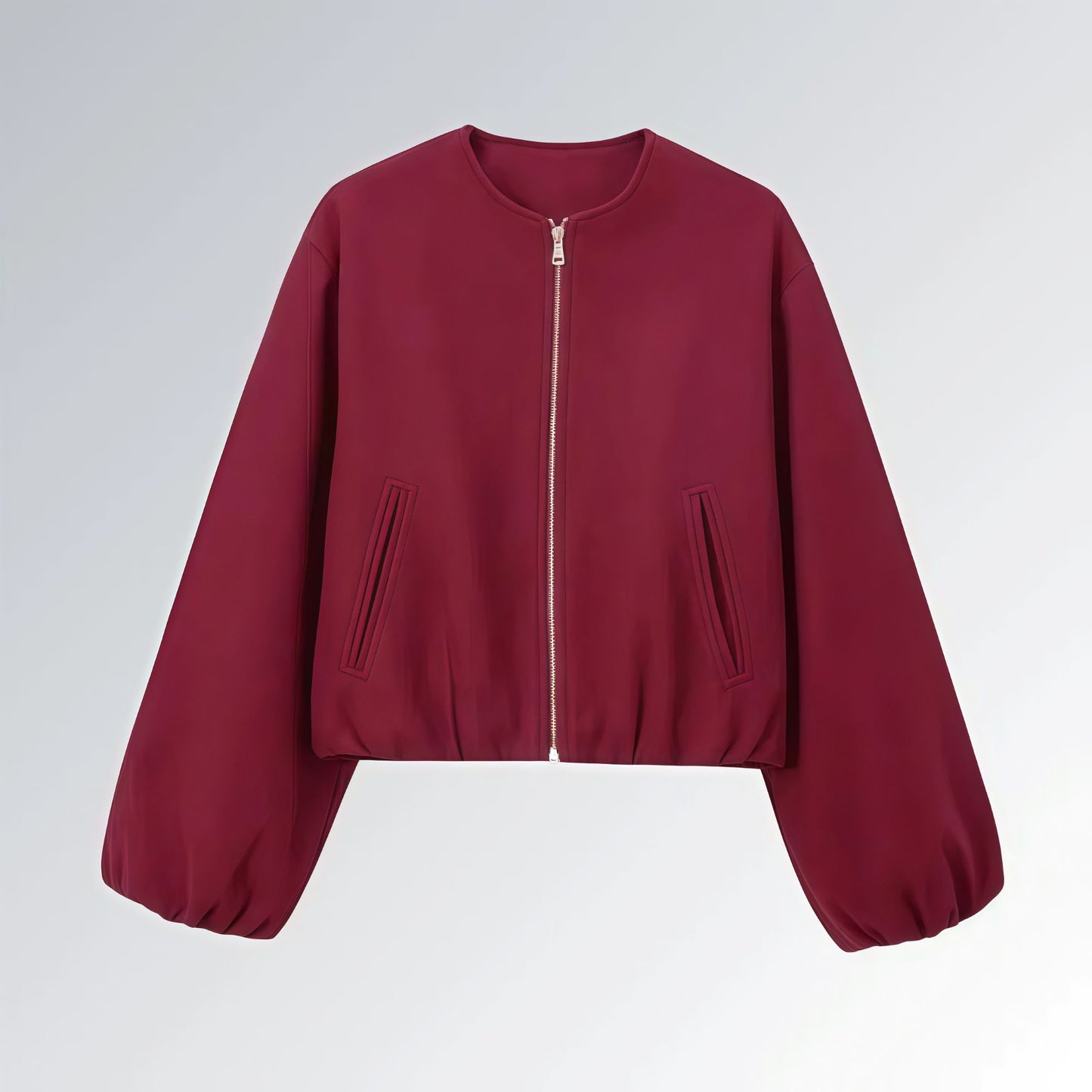 Jaqueta feminina vinho com zíper metálico, mangas bufantes e bolsos frontais, estilo casual streetwear para o outono.