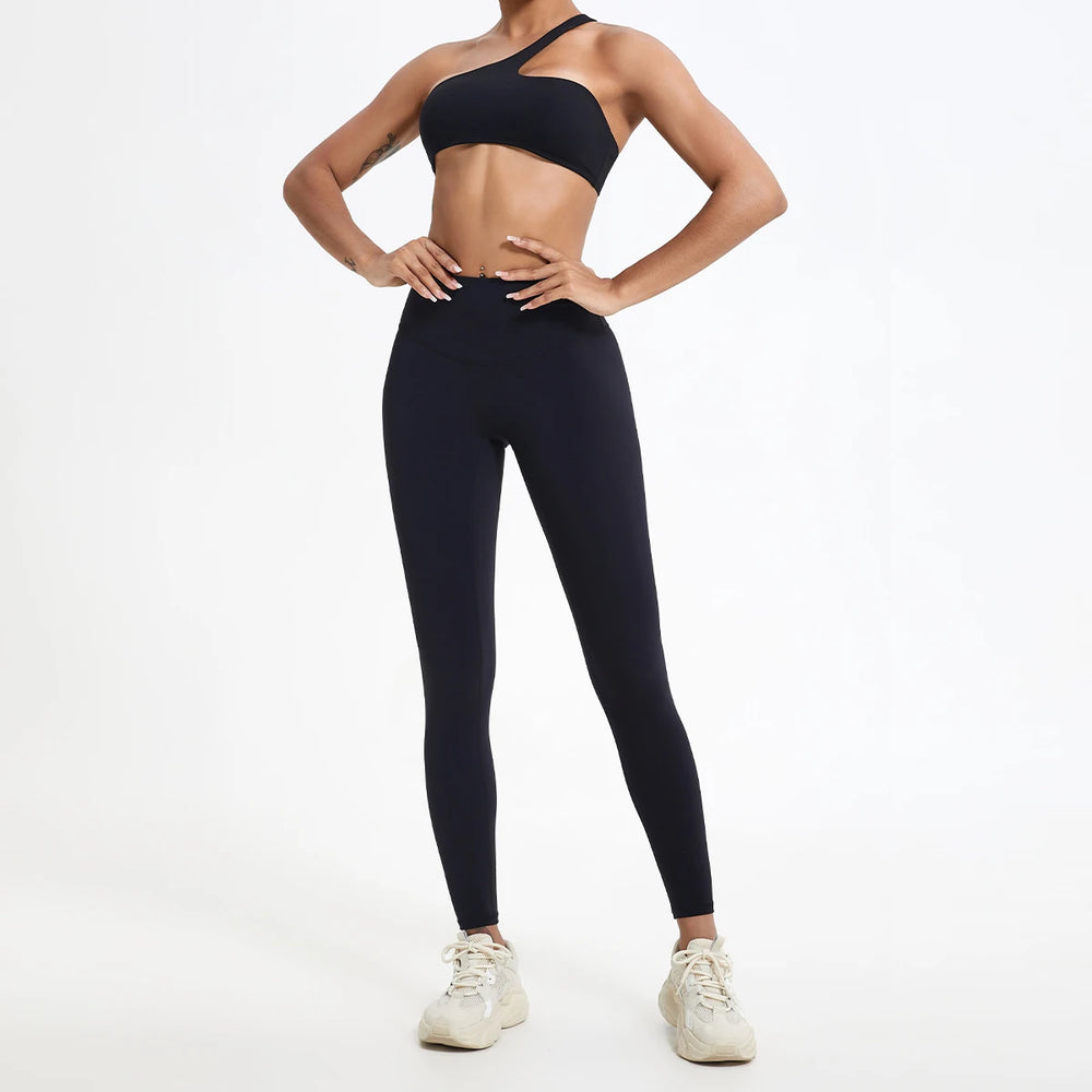 Calça legging feminina preta de cintura alta, modelo compressão, ideal para academia, yoga e treinos, com ajuste anatômico e tecido elástico.